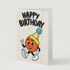 May include: A birthday card with a basketball character wearing a party hat. The card has a woodgrain background with a yellow and orange pattern. The text on the card reads 