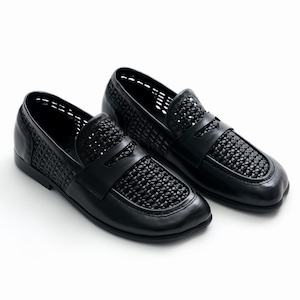 May include: A pair of black leather loafers with woven detailing on the vamp and sides. The shoes have a classic slip-on design with a low heel and a rounded toe. The shoes are set against a white background.