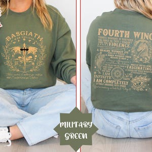 May include: A green sweatshirt with a gold graphic print of a dragon and the text "Fourth Wing There's nowhere in existence you could go that I wouldn't find you. Violence. A dragon without its rider is a beast without fear. There is no dragon in the skies today but I am infinite. I am completely utterly obsessed with jade. You're making a bad with every step. Fascinating. None of this worth it without you."