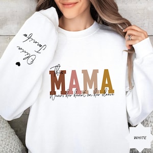 Custom This Mama Wears Her Heart On Her Sleeve Hoodie, Personalized Mom Sweatshirt With Kids Names, Cute Momma Outfit, Mothers Day Gifts