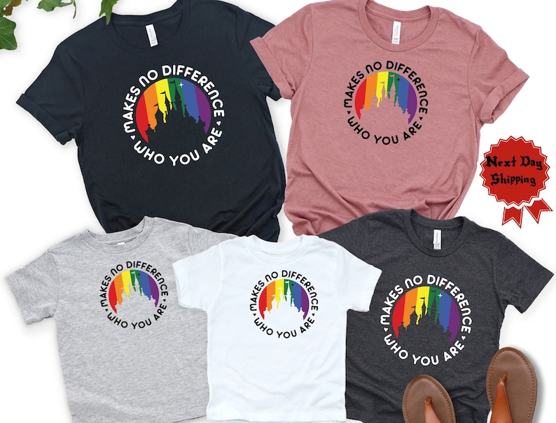 May include: Four t-shirts with a rainbow castle graphic and the text "Makes no difference who you are." The shirts are in different colors: black, gray, white, and heather gray.