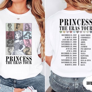 May include: White t-shirt with a graphic of Disney princesses and the text "Princess The Eras Tour". The back of the shirt has a list of Disney princesses with their release dates.