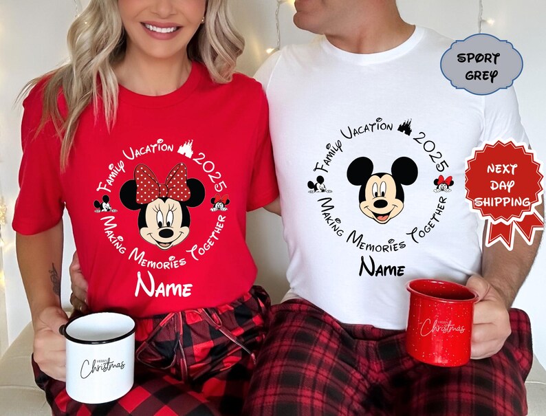 May include: Coordinating red and white t-shirts featuring Mickey and Minnie Mouse designs, ideal for a family holiday in 2025. The shirts display the text "Family Vacation Making Memories Together" and "Name". Each person holds a mug with the word "Christmas".