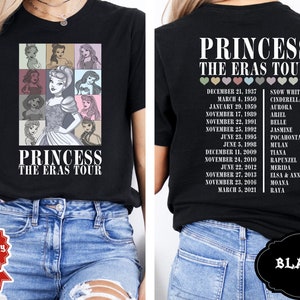 May include: Black t-shirt with a graphic of Disney princesses and the text "Princess The Eras Tour". The back of the shirt lists the princesses and their release dates.
