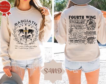 May include: A cream-colored sweatshirt with a black and white graphic print of a dragon and text that reads "Basgiath War College" on the front and "Fourth Wing There's nowhere in existence you could go that I wouldn't find you. Violence. A dragon without its rider is a tragedy. A rider without their dragon is nothing. There is nothing in this world that I find more fascinating. Once if you're mine none of this worth without you. I am infinite. I am completely utterly obsessed with you. You're making me look bad. Stop it." on the back.