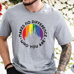 May include: A gray t-shirt with a rainbow-colored circle around a silhouette of a castle. The text "Makes no difference who you are" is written around the circle.