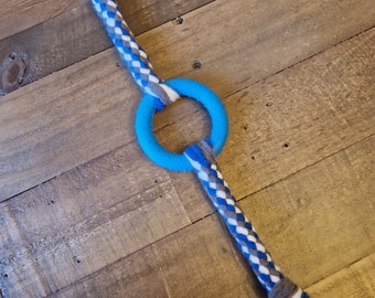 Dog tug toy with hoop in the middle