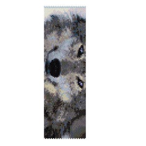 May include: A beaded bracelet featuring a detailed portrait of a wolf's face. The design uses a mosaic pattern with shades of gray, black, and blue beads. The wolf's eyes are a striking blue, and the overall effect is artistic.