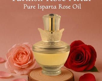 May include: A glass bottle of Turkish Rose Attar, with a gold-coloured top, sits on a wooden coaster. The bottle is surrounded by a pink rose, a red rose, and rose petals. The text "Turkish Rose Attar Pure Isparta Rose Oil" is at the top.