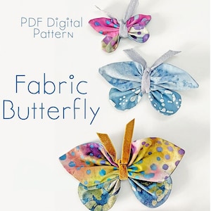 May include: Three fabric butterflies in shades of pink, blue, and yellow with patterned wings. The butterflies have ribbon or velvet accents. Text on the image reads "PDF Digital Pattern" and "Fabric Butterfly".