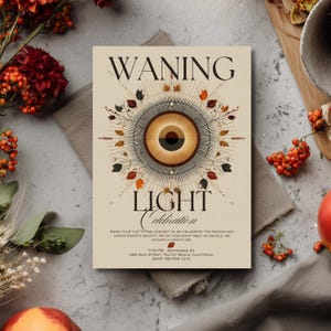May include: A beige invitation card with the words "WANING LIGHT Celebration" in a decorative font. The card features an eye-like design with autumnal colors and text that reads "Raise your cup to the harvest..." and event details.