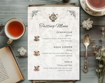 May include: A white menu card with a decorative border and floral pattern. The menu lists three tea options: Genmaicha, Aqua Summer, and Paris. Each tea is described with its name, brand, and flavor profile. The menu is illustrated with three teacups and a teapot.
