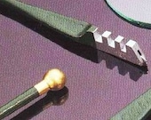 Fletcher Glass Cutter. Inexpensive way for cutting Clear Microscope Glass. Dip into any oil, score (scratch) then break.