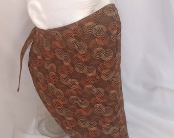 Bandana style facial covering for adults - orange circles on brown printed cotton