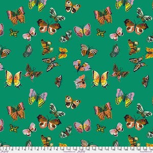 May include: A fabric with a repeating pattern of colorful butterflies in various sizes on a green background. The butterflies have detailed wing patterns in shades of orange, yellow, pink, and brown.