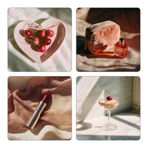May include: A selection of beauty and lifestyle products. A pink heart-shaped dish contains fresh cherries. A small, peach-coloured velvet cosmetic bag and a perfume bottle are on a textured surface. A tube of red lipstick rests on a silk scarf. A cocktail glass with a cherry garnish.