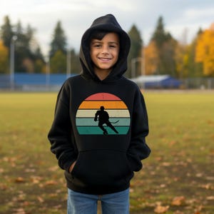 Hockey Kids Hoodie | Boys Hockey Sweatshirt | Hockey Silhouette Design | Gift for Young Players | Rinkside Apparel | Hockey-Themed Clothing