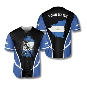 May include: Baseball jersey with a black and blue design. The front features a baseball player graphic and the flag of Nicaragua. The back has the text "YOUR NAME" above a map of Nicaragua with its flag.