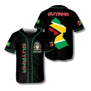 May include: Black baseball jersey with green and red accents. The jersey features the word "GUYANA" vertically down the front and across the back. A map of Guyana and the country's flag are also displayed.