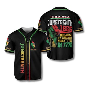 May include: Black baseball jersey with green, red, and yellow accents. The front features the word "Juneteenth" vertically. The back displays "July 4th Juneteenth 1865" with a raised fist graphic and the text "Because my ancestors weren't free in 1776."