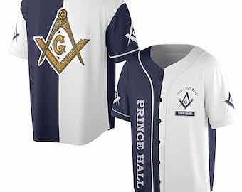 May include: A white and navy blue baseball jersey with a Masonic symbol on the front and the text "Prince Hall" on the side. The symbol is a compass and square with a "G" in the center.