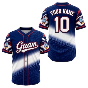 May include: A blue and white baseball jersey featuring the word Guam in white script on the front, a button-down closure, and the Guam flag on the sleeves. The back displays the text YOUR NAME and the number 10 in white with red outlines.