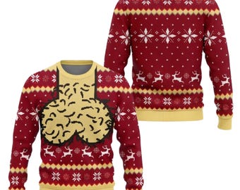 May include: A long-sleeved crewneck sweater in deep red with yellow trim at the collar, cuffs, and hem. The design features a repeating pattern of white snowflakes and reindeer, with a large, central graphic of two beige, textured shapes.