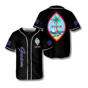 May include: Black baseball jersey with white trim, featuring the Guam seal on the front and back. The front has the word "Guam" in blue script and a space for a name. The back displays a palm tree, sailboat, and the word "Guam".