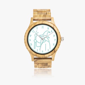 May include: Wooden wristwatch with a light blue wizard graphic on a white face. The watch has a light brown wooden band and case. The watch face features runes around the edge.