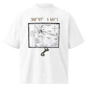 May include: White t-shirt with a mock neck and short sleeves. The shirt features a black and white map graphic with text and a key design. Brown text is above the map.