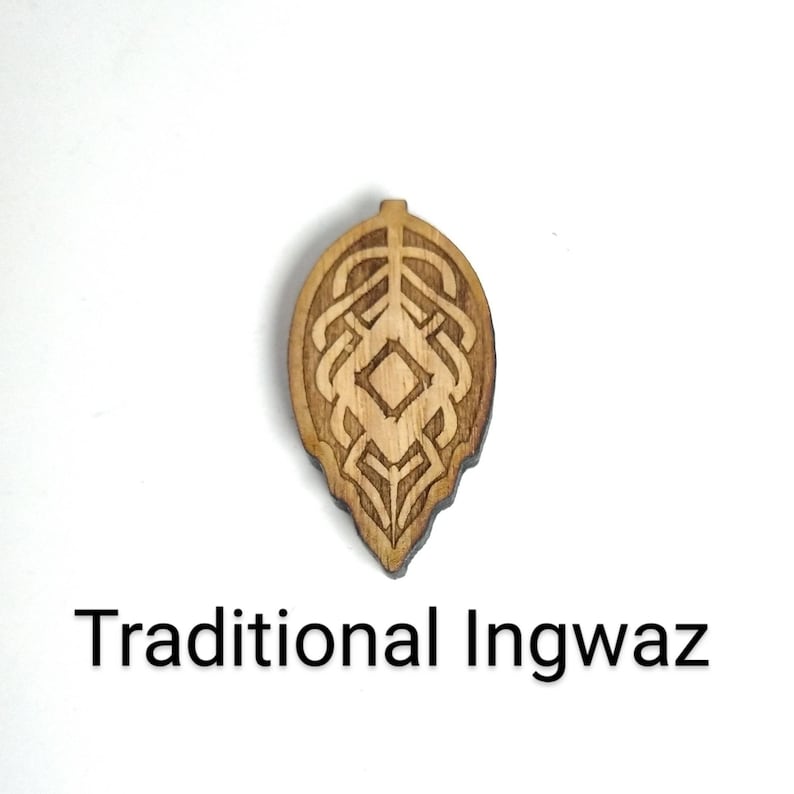May include: A wooden pendant with a carved design of a leaf with a diamond shape in the center. The pendant is labeled "Traditional Ingwaz".