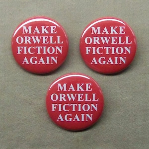 May include: Three red round buttons with white text that reads "Make Orwell Fiction Again".