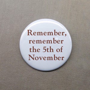 May include: White round button with the text "Remember, remember the 5th of November" in brown lettering.