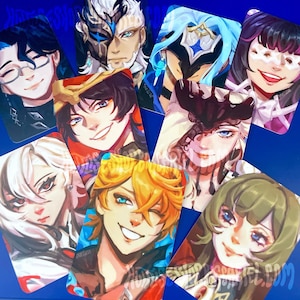 May include: A collection of eight rectangular trading cards featuring colorful digital illustrations of various anime-style characters with distinct facial features, hairstyles, and expressions, arranged in a scattered overlapping pattern.
