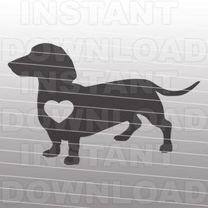Puede incluir: Silueta de un perro dachshund con un coraz&oacute;n en el pecho. El perro es negro y el coraz&oacute;n es blanco.
