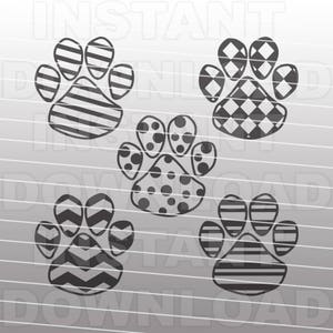 May include: Set of five black and white paw print designs. The paw prints feature different patterns, including stripes, polka dots, and a chevron pattern.