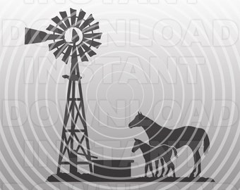 May include: A black silhouette of a windmill with a trough and two horses, one adult and one foal, standing next to it. The background is a gray and white circular pattern.