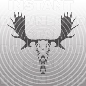 May include: Black and white silhouette of a moose skull with large antlers. The skull is centered in the image against a gray background with concentric circles.