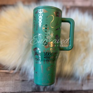 May include: A teal Hydro Jug with a handle, featuring engraved medical symbols and the text "Eat Sleep Nurse Repeat." The jug also has the text "Engraved Expression Co." and other graphics.