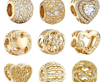 Dijes de circonita cúbica chapados en oro compatibles con pulseras Pandora. Dijes de corazón. COMPRA 3 Y LLÉVATE UN 65 % DE DESCUENTO.