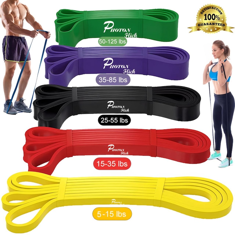 May include: Set of five resistance bands in different colors and resistance levels: yellow (5-15 lbs), red (15-35 lbs), black (25-55 lbs), purple (35-85 lbs), and green (50-125 lbs). Each band has the brand name "Photon Hick" printed on it.