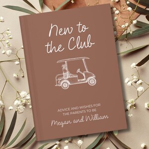 Op de afbeelding: Een bruin boek met de tekst "New to the Club" in witte letters, samen met een witte lijntekening van een golfkarretje. De tekst "ADVICE AND WISHES FOR THE PARENTS TO BE" en de namen "Megan and William" zijn ook zichtbaar.