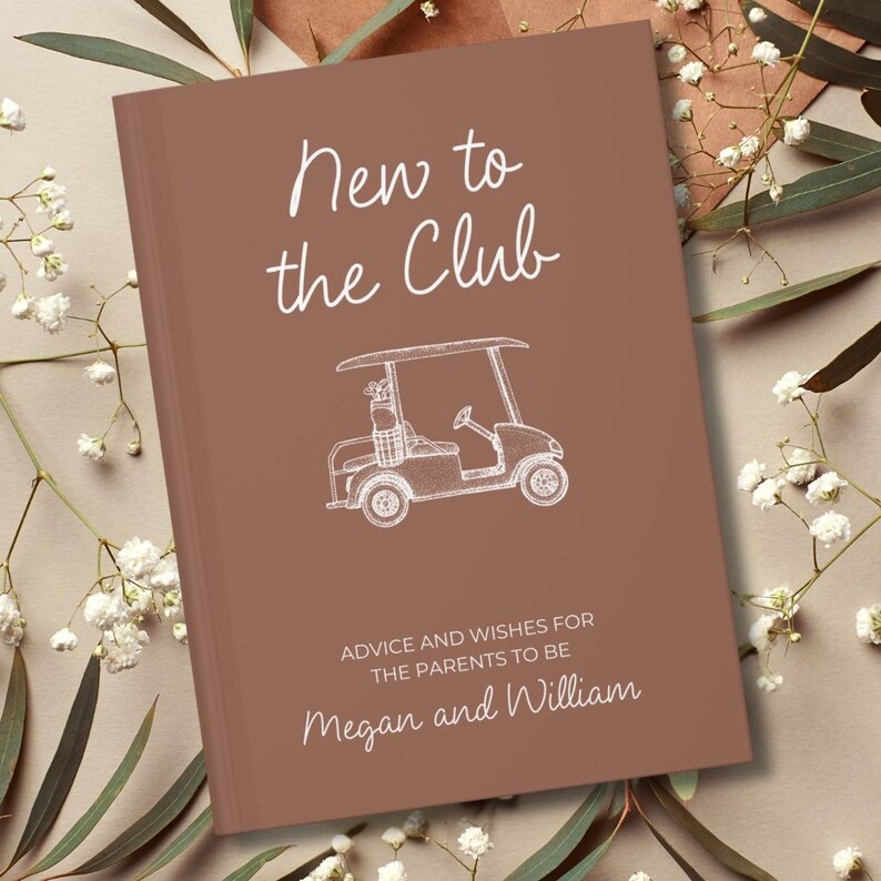 Op de afbeelding: Een bruin boek met de tekst "New to the Club" in witte letters, samen met een witte lijntekening van een golfkarretje. De tekst "ADVICE AND WISHES FOR THE PARENTS TO BE" en de namen "Megan and William" zijn ook zichtbaar.