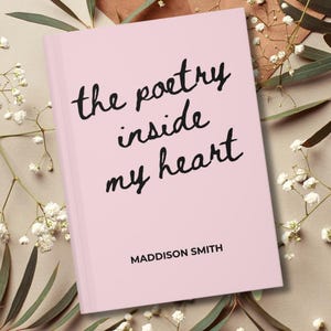 May include: A pink book with the title "the poetry inside my heart" in black cursive font. The author's name, Maddison Smith, is printed below the title. The book is surrounded by white flowers and green leaves.