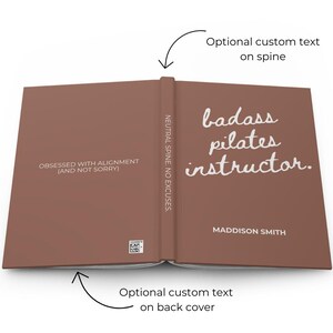 May include: A brown book with the text "badass pilates instructor" in white script. The spine reads "NEUTRAL SPINE. NO EXCUSES." The back cover has the text "OBSESSED WITH ALIGNMENT (AND NOT SORRY)." The author's name, Maddison Smith, is also visible.