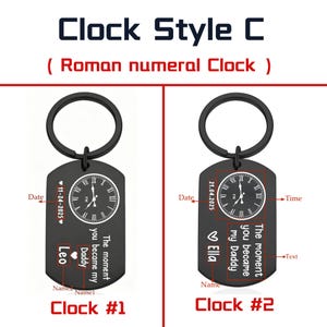 May include: Two black keychains with a clock design. Each keychain has a circular clock face with Roman numerals and the text "The moment you became my Daddy." One keychain says "Leo" and the other says "Ella."