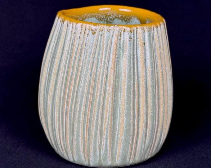 handmade porcelain cup in green and orange
