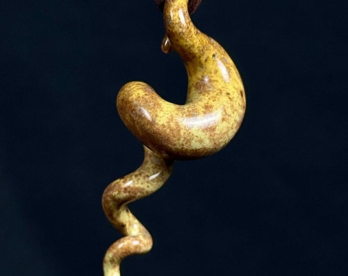 handmade porcelain squiggle pendant in yellow and beige
