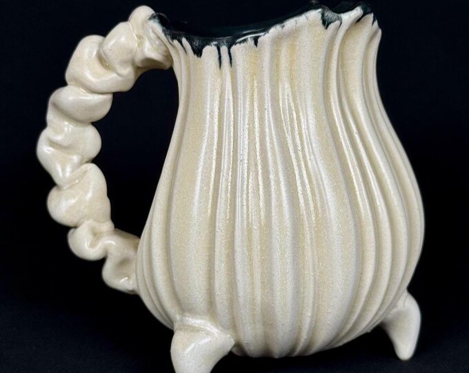 handmade whimsical porcelain tripod mug in white and black