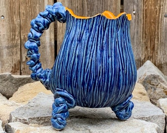 handmade ceramic mug in blue and orange